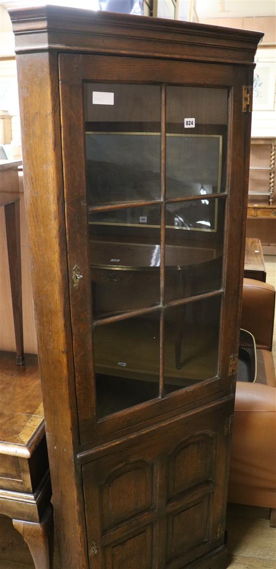 A glazed oak corner cupboard W.69cm